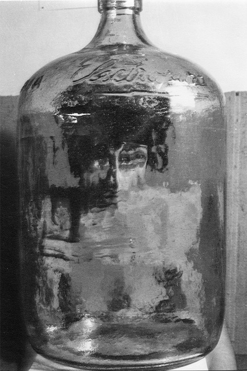 woman in glass jar