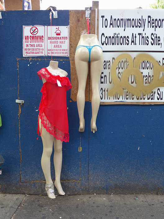 Mannequins on a fence